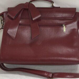 This is a classy/ professional  burgundy Ecosusi designer backback